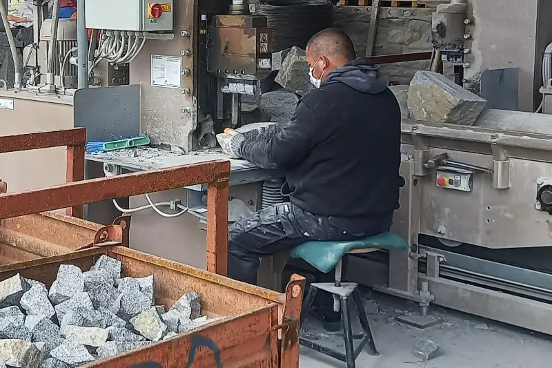 Work on paving stone splitter while seated